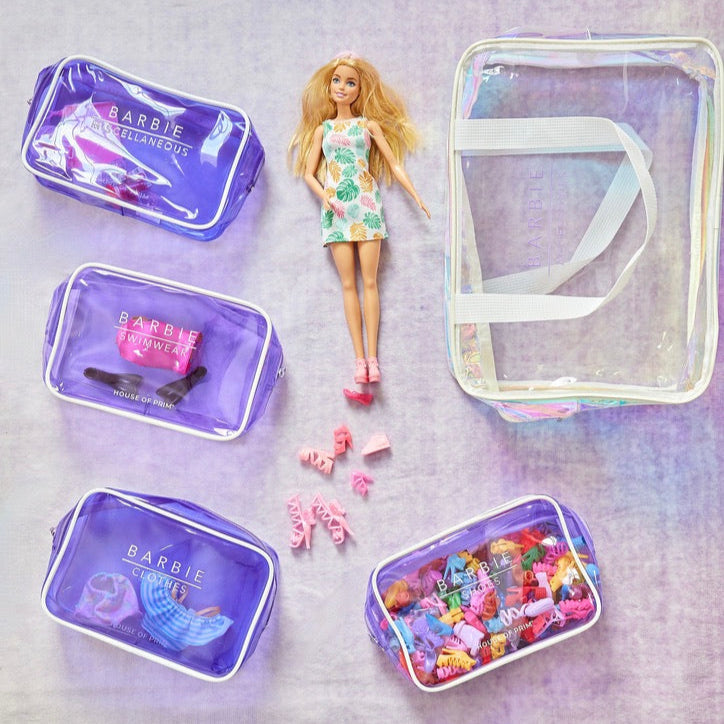 Barbie doll with accessories on a textured surface